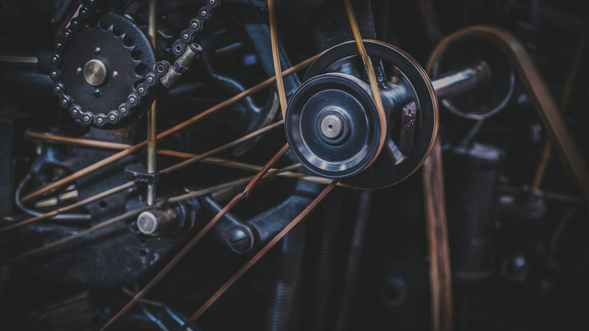 Drive belts running over pulleys inside a machine