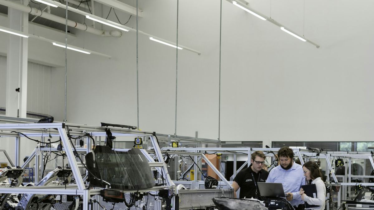 Manufacturing engineers reviewing equipment on the factory floor